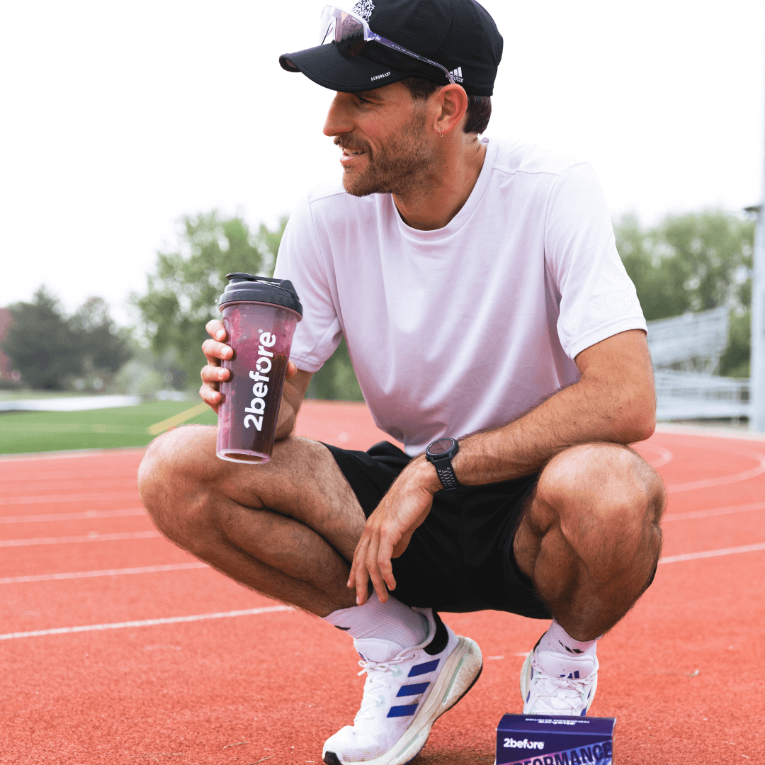 Track runner drinking 2before blackcurrant powder pre-workout